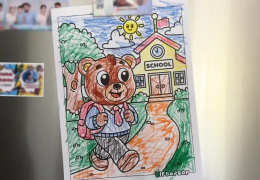 The finished colored page on a fridge